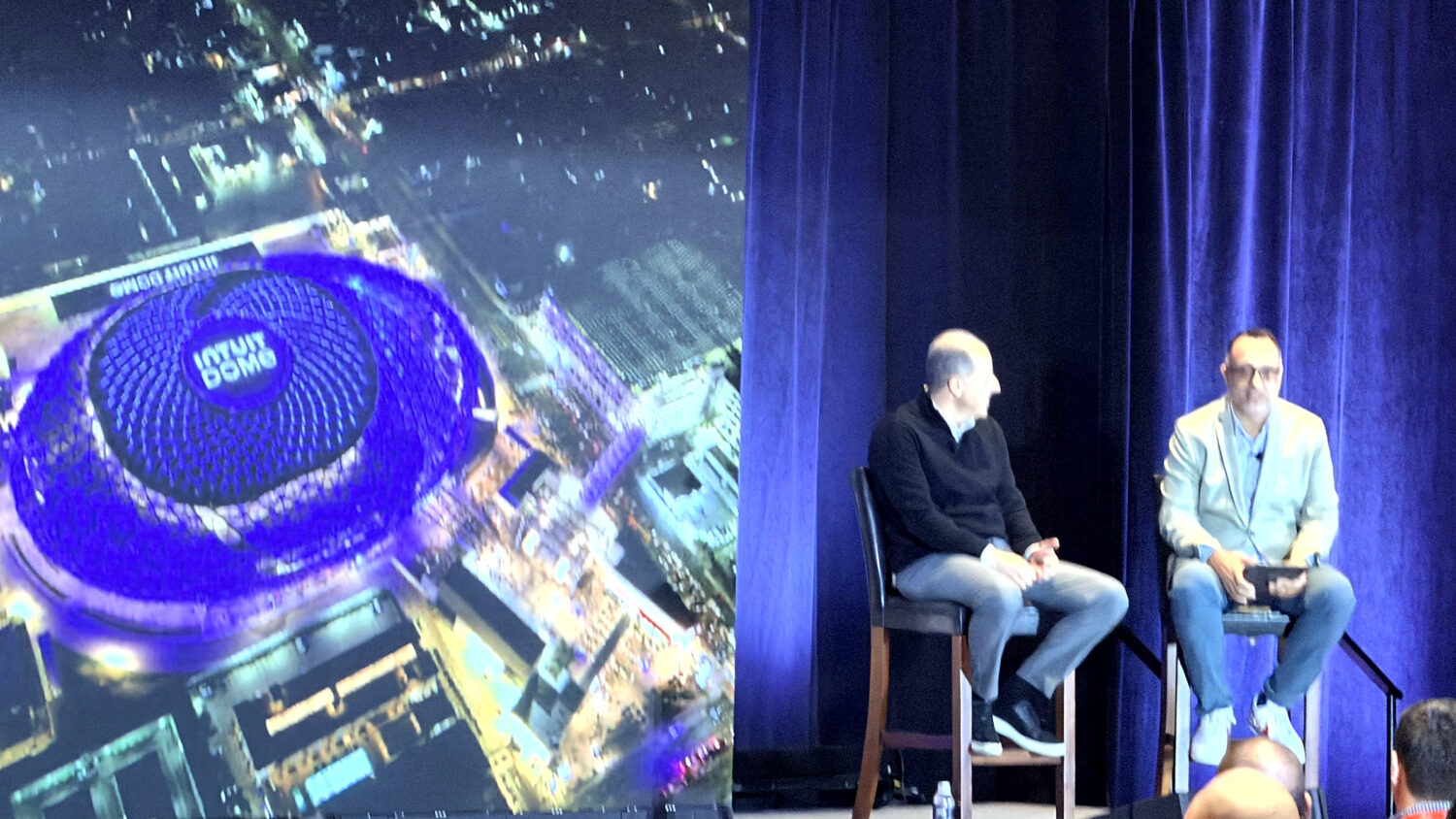 Two speakers in conversation onstage at SEAT Charlotte 2026